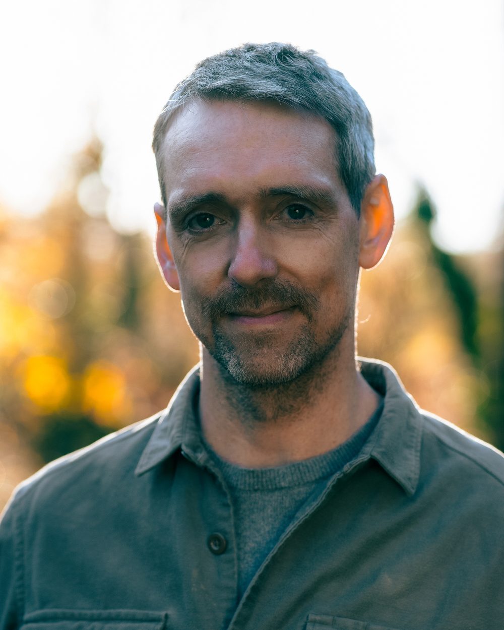 Portrait of Nicholas Allan outdoors in autumn light